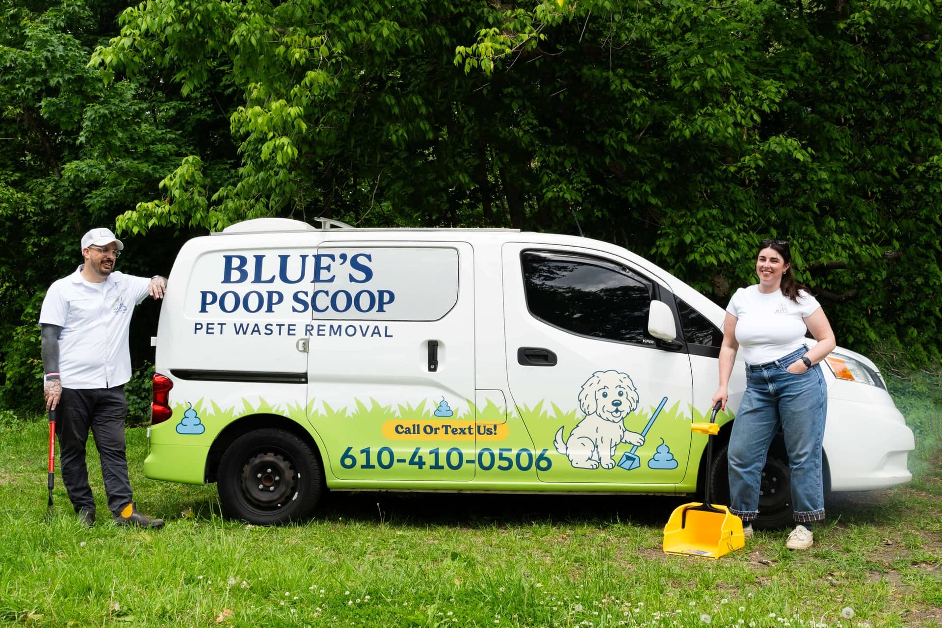 The two owners of Blue's Poop Scoop standing beside their branded green and white van